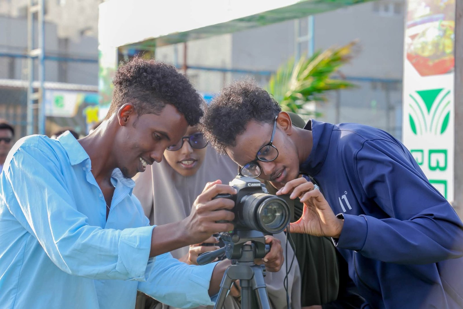 Students checking a camera together